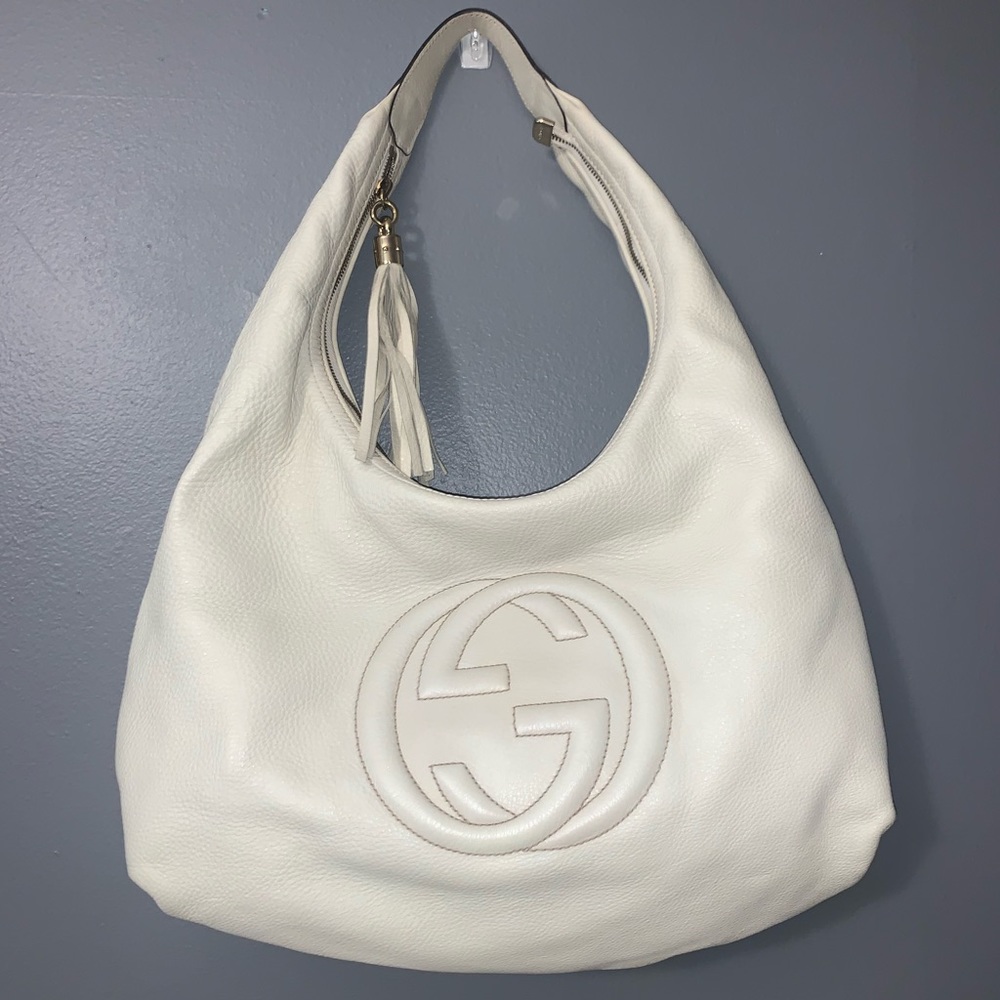 Gucci white Soho boho bag.  I added pictures.  Only carried twice.